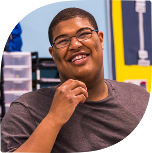 High school boy laughing in classroom