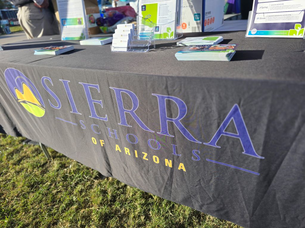 Sierra Schools of Arizona booth cover at YES Day Walk for Autism resource fair