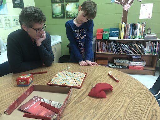 The Auburn School student playing game with veteran teacher Paris Thalheimer