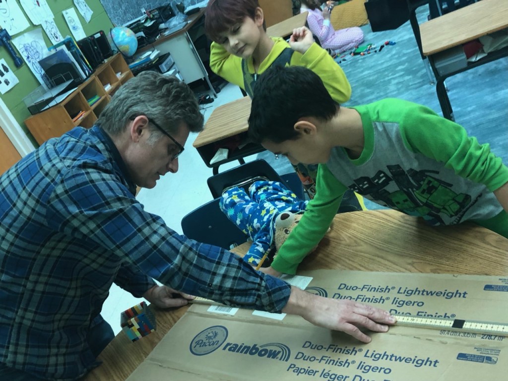 Classroom of students engaged in discussion led by veteran teacher Paris Thalheimer