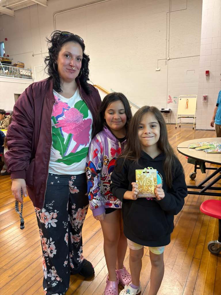 Students and parents smiling during Southbridge Family Game Night activities