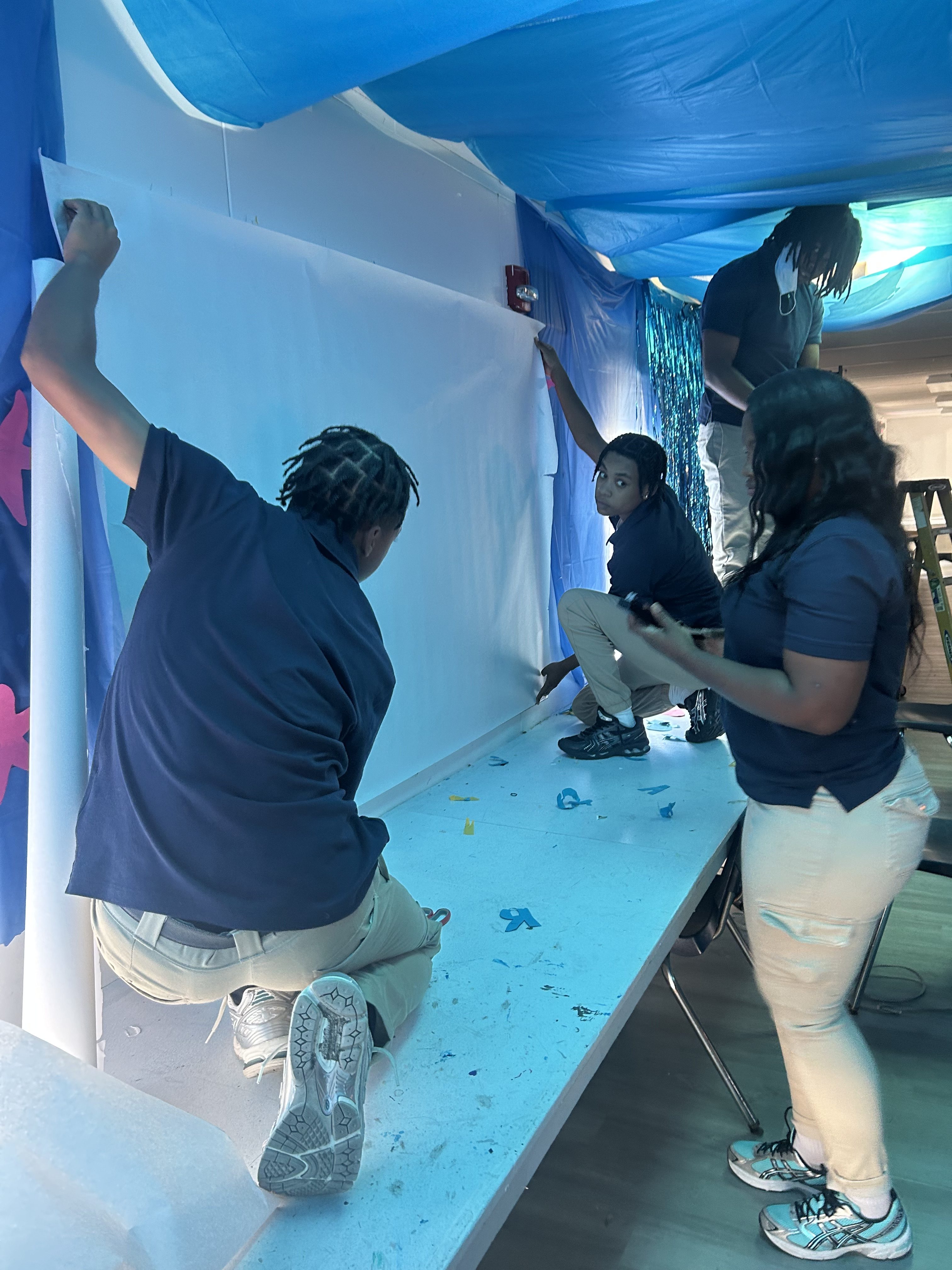 Teacher Olivia Mullen guiding students through creative Shark Week activity