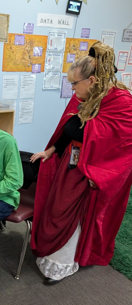 Air Force veteran teacher Suzy Cherry leading a special education class at Sierra School of Gateway during Halloween