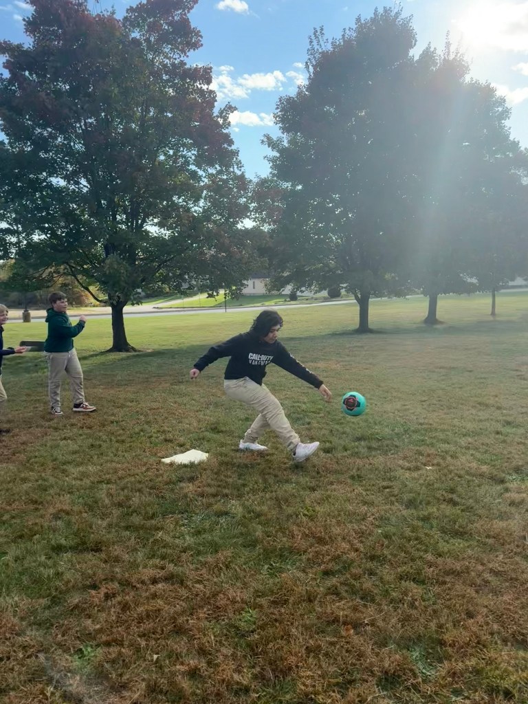 Students playing kickball during Fun Friday activities.