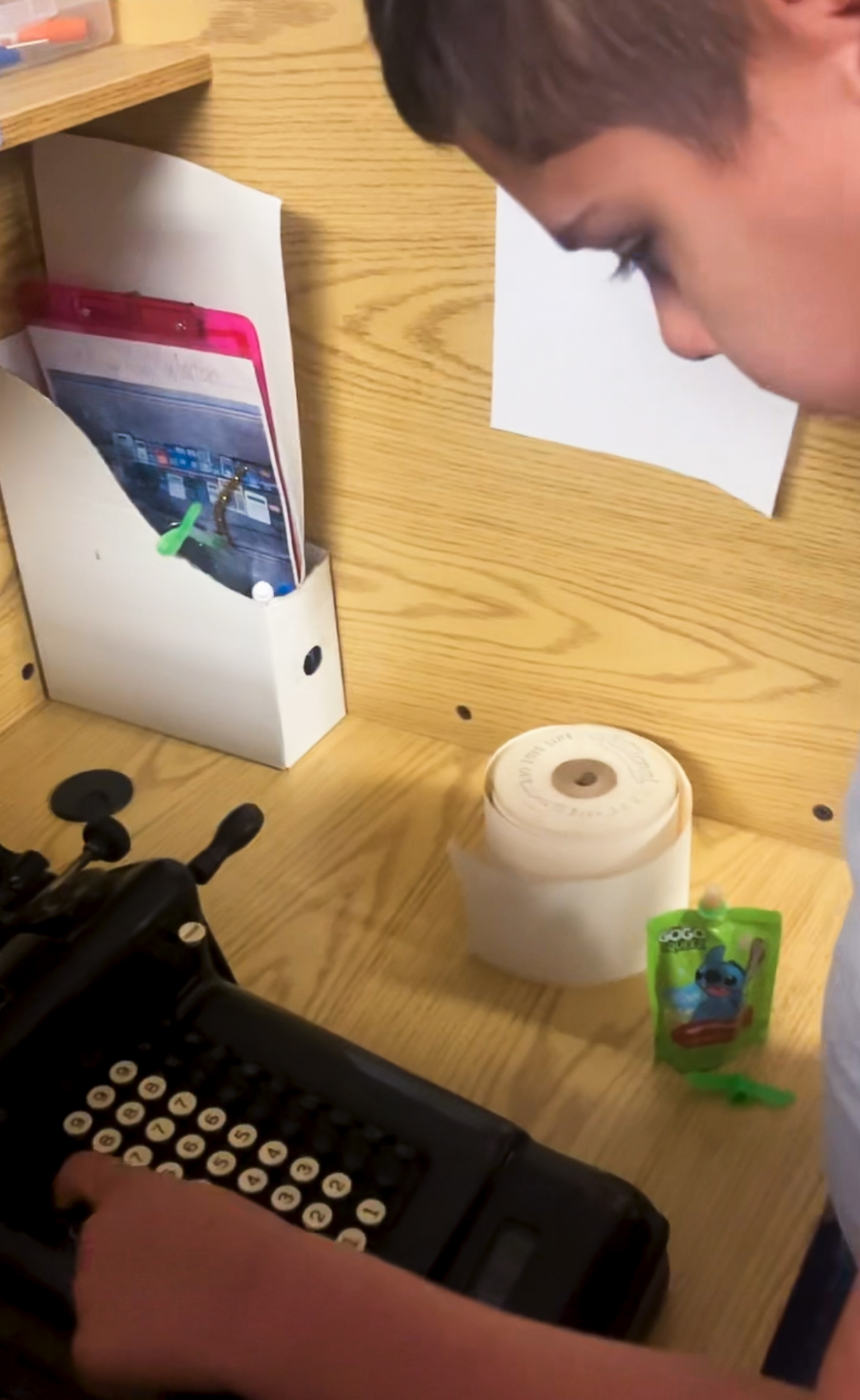 High Road School of Darien student Noah examining antique adding machine