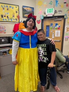 Teacher dressed as Snow White with smiling student at Lattice Fall Festival 2025.