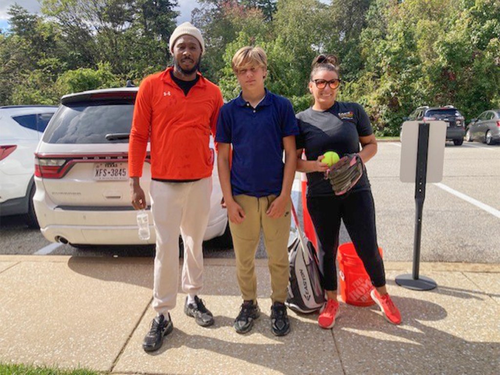 DJ with staff members making progress at High Road School