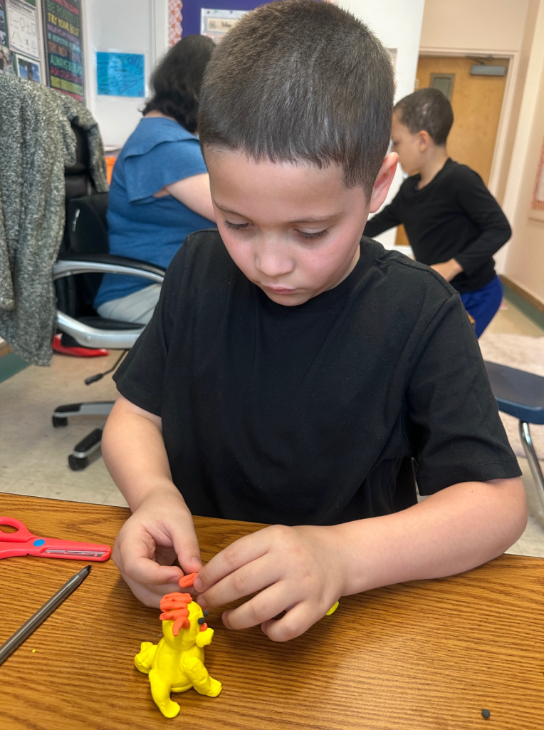 Sebastian building fine motor skills during hands on learning