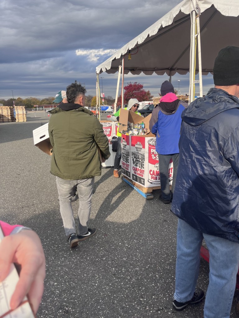 Staff organizing canned goods during the food drive