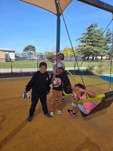 students collaborating during outdoor learning field trip at local park
