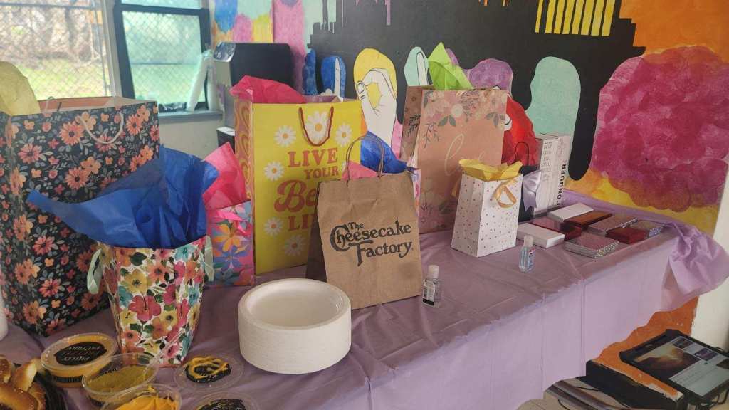 Bingo prizes including gift baskets and school gear at family event