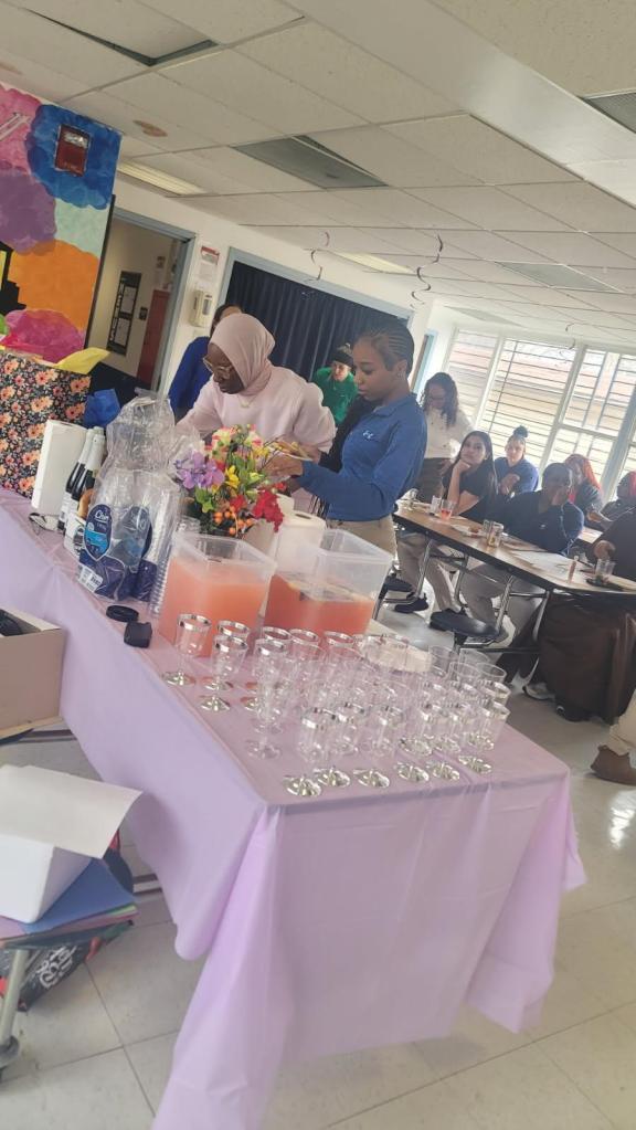 Families enjoying refreshments during Women’s History Month celebration