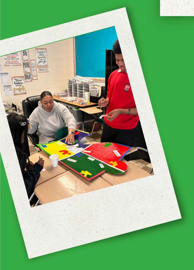 Staff and students engaging in Autism Awareness Month event