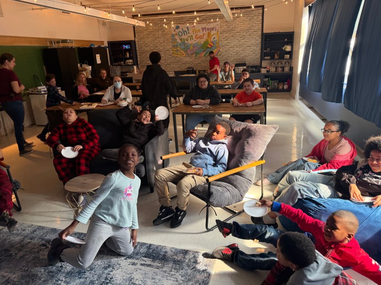 Students and staff participating in classroom activity during reading program