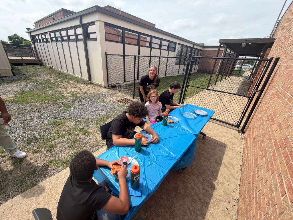 Students interacting and connecting during schoolwide tailgating event