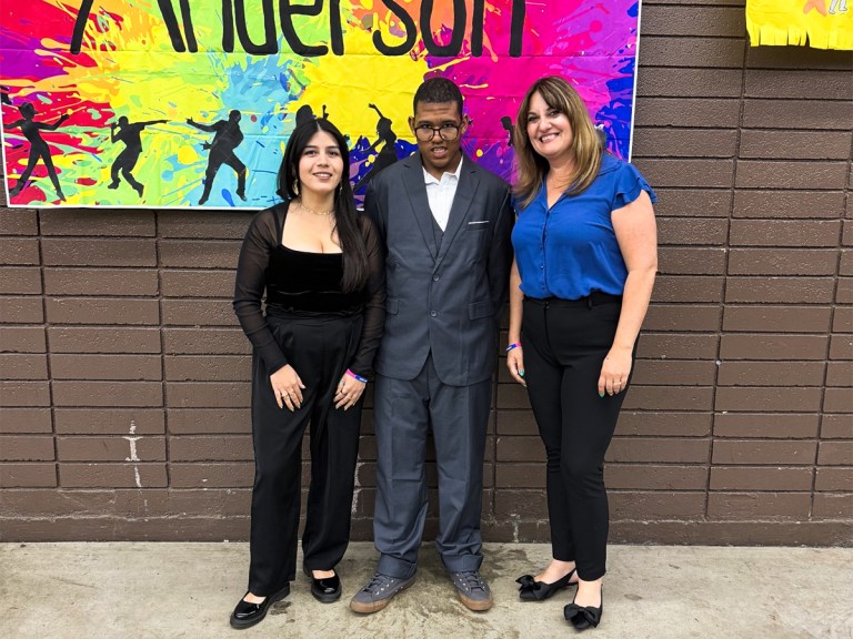 Sierra School at San Bernardino City student and staff smiling at district prom event