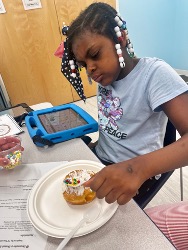 Teresa with a cupcake during a classroom celebration