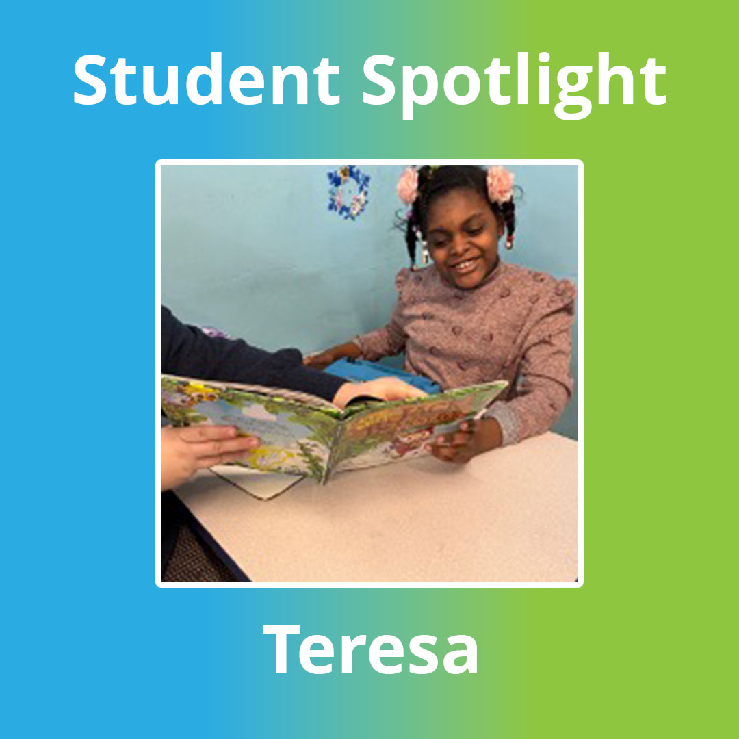 Teresa smiling while reading