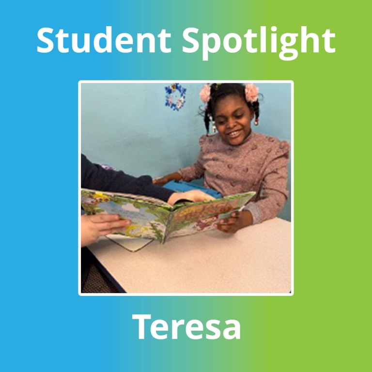 Teresa smiling while reading