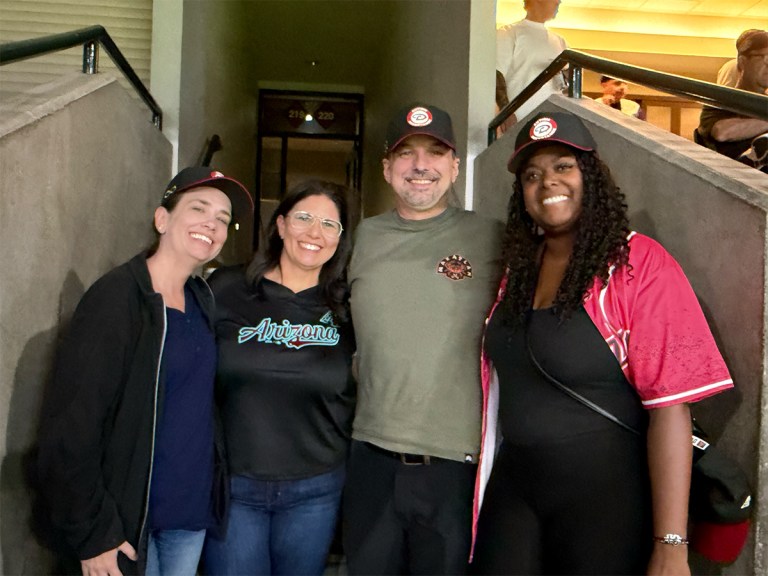 Sierra Schools of Central Arizona staff members pose together in Arizona Diamondbacks gear at Chase Field.