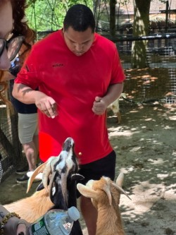 Vaughn interacting with goats during his first school field trip at Southwick Zoo.