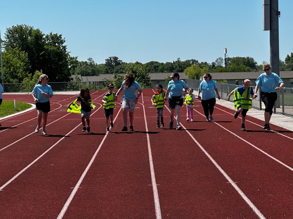 Students and staff enjoying relay races during Field Day at Wright City