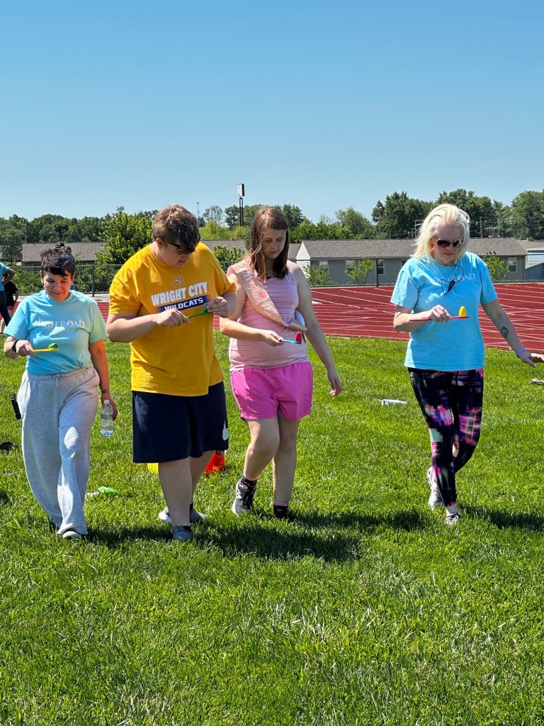 Students participating in a teamwork activity during Field Day games