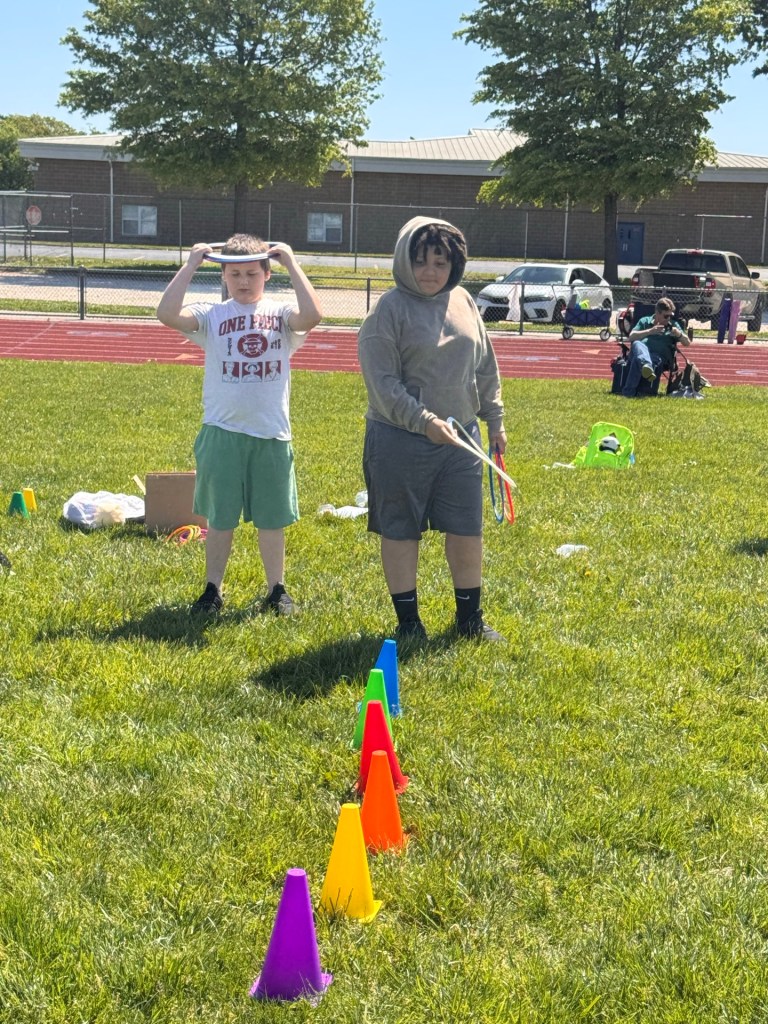 Students preparing for a ring toss challenge during Field Day