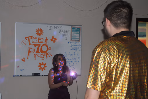 Students dancing together during the 70s themed prom at NewHope Academy.