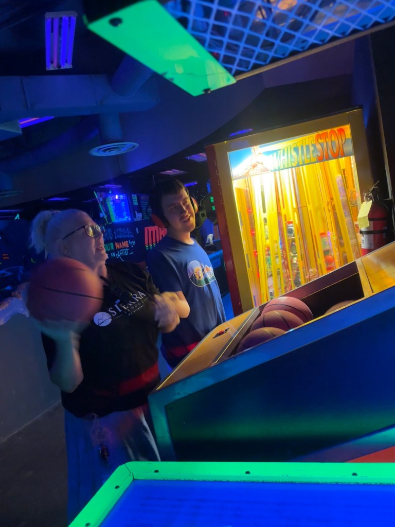 Student playing arcade basketball game during Sierra Gilbert CASE Fun Friday event at 3D Mini Golf in Gilbert, Arizona.