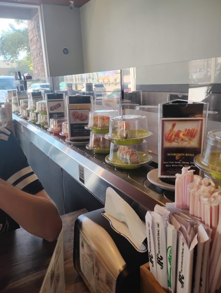 Interior view of a sushi restaurant during an outing.