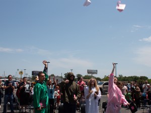 Graduates tossing caps in the air to celebrate graduation at High Road School of Wright City
