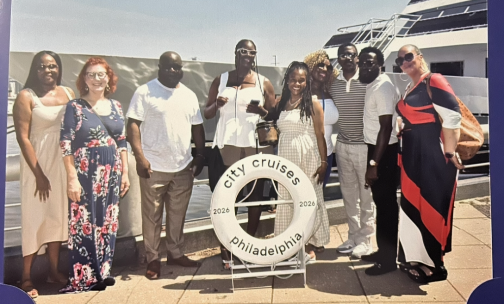 Excel Middle Years Academy staff and families posing aboard the Spirit of Philadelphia before departure.