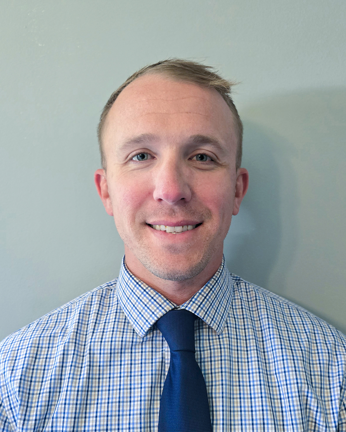 Professional staff portrait of Collin Kelly, Associate Director at High Road School of York.