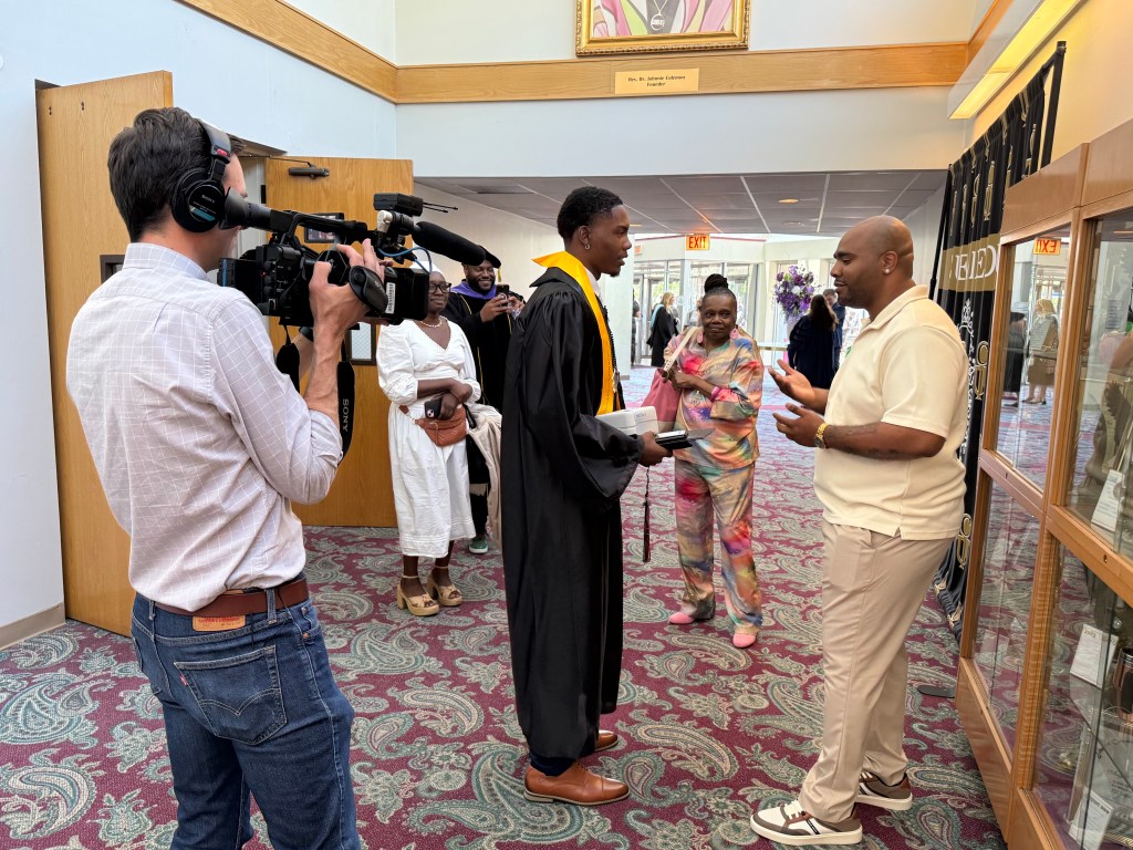 CBS Chicago crew films a conversation between Raynard Gillespie and Class of 2026 valedictorian Zachary McCraney at Excel Academy of Englewood.