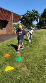 Student completing an outdoor activity course during BEST Academy Field Day.