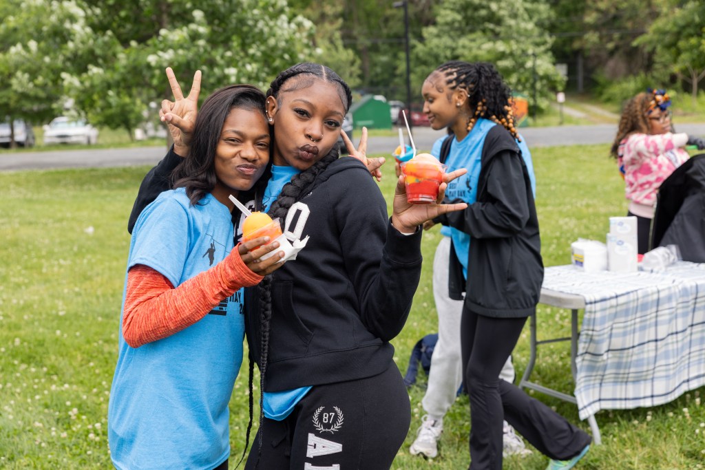 Students enjoy frozen treats and celebrate the end of the school year during May Day festivities.