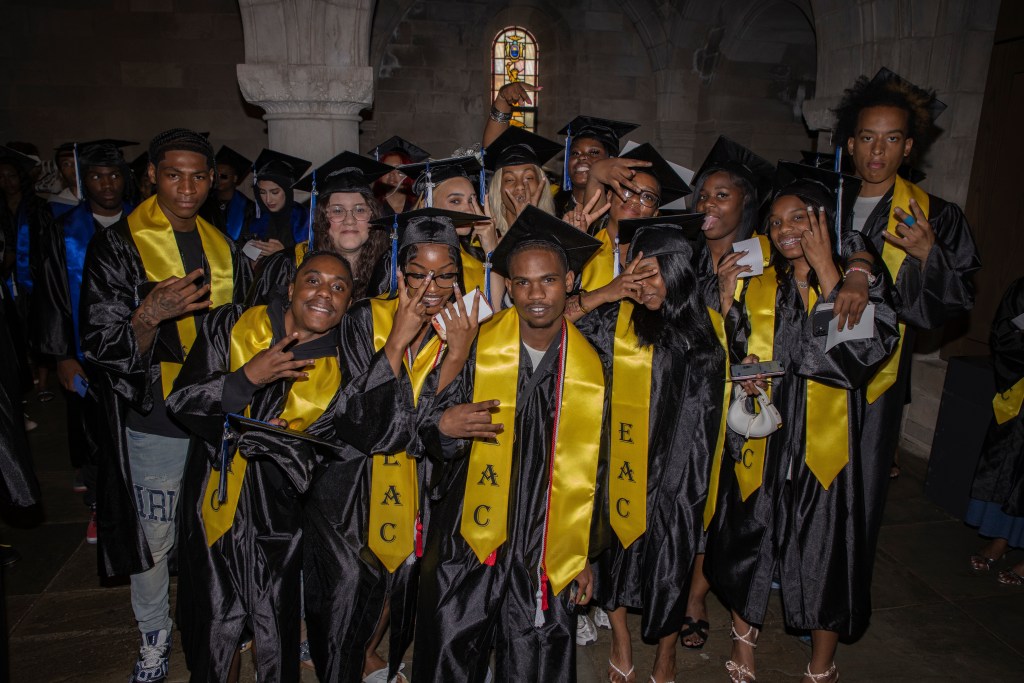 Achieve Academy graduates gather for a celebratory group photo after graduation.