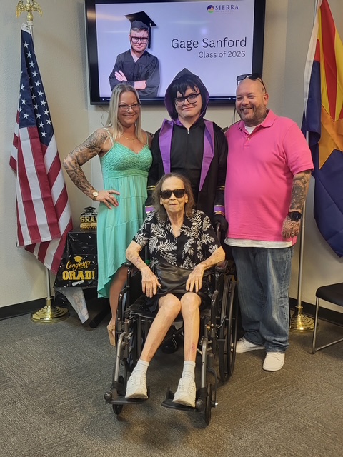 Gage Sanford celebrates graduation with family members during Sierra School of Gilbert's Class of 2026 ceremony.