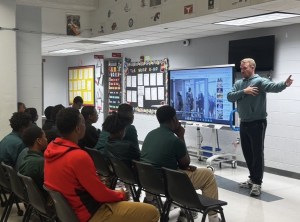 Mike Morak speaks to students at Excel Middle Years Academy as part of the Final Word Campaign, sharing lessons from his sports marketing career.