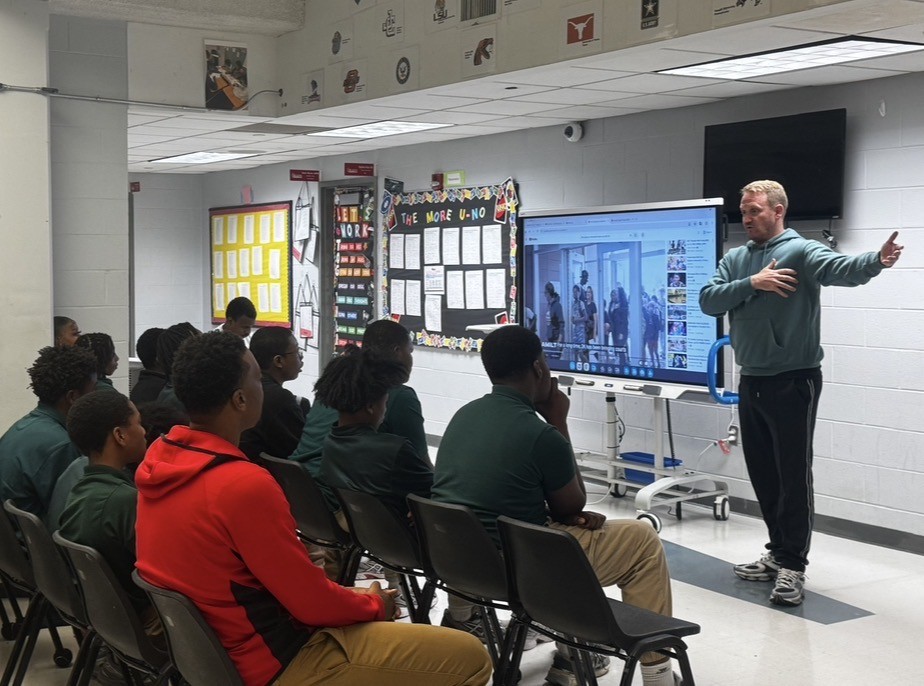 Mike Morak speaks to students at Excel Middle Years Academy as part of the Final Word Campaign, sharing lessons from his sports marketing career.