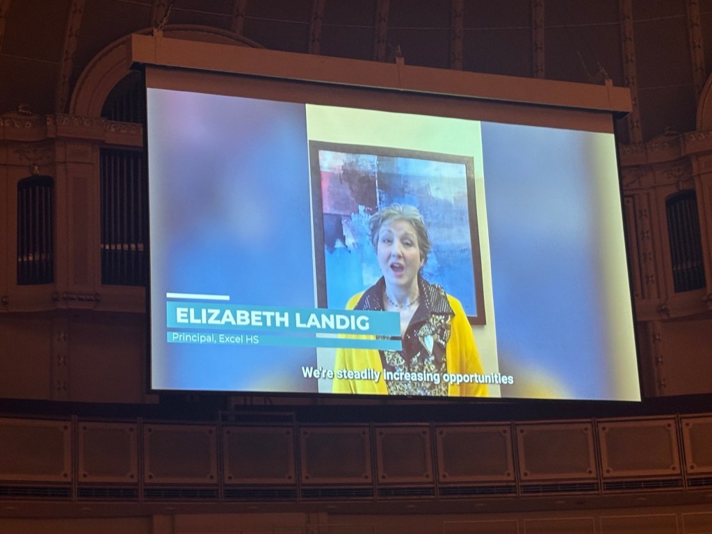 Principal Elizabeth Landig featured on screen during the 2026 CPS Game Changer recognition ceremony.
