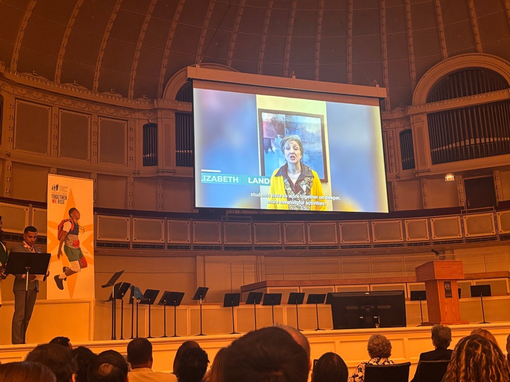 Elizabeth Landig shown on the large screen during the Chicago Public Schools leadership celebration.
