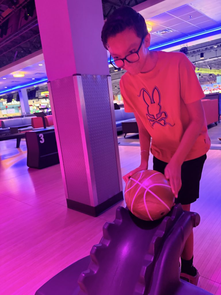 Sierra Gilbert student prepares to bowl during the school’s Fun Friday community outing.