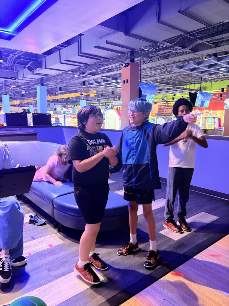Sierra Gilbert students socialize together between turns during a bowling outing.