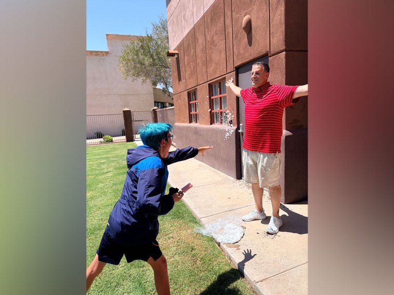 Sierra School of Gilbert student throws a snowball toward a staff member during the Fun Friday celebration.