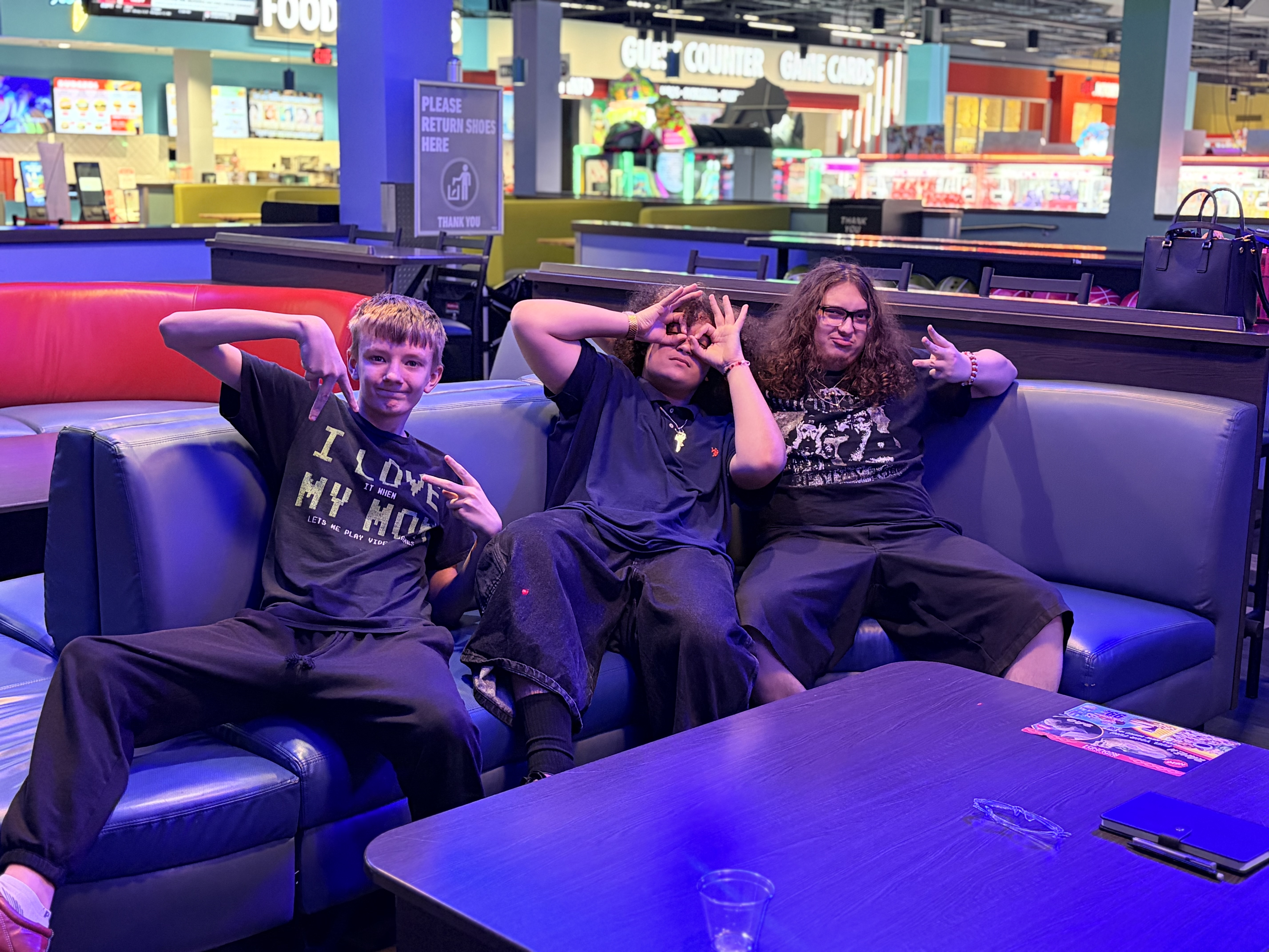 Three Sierra Gilbert students relax together during their Fun Friday trip to Round1.
