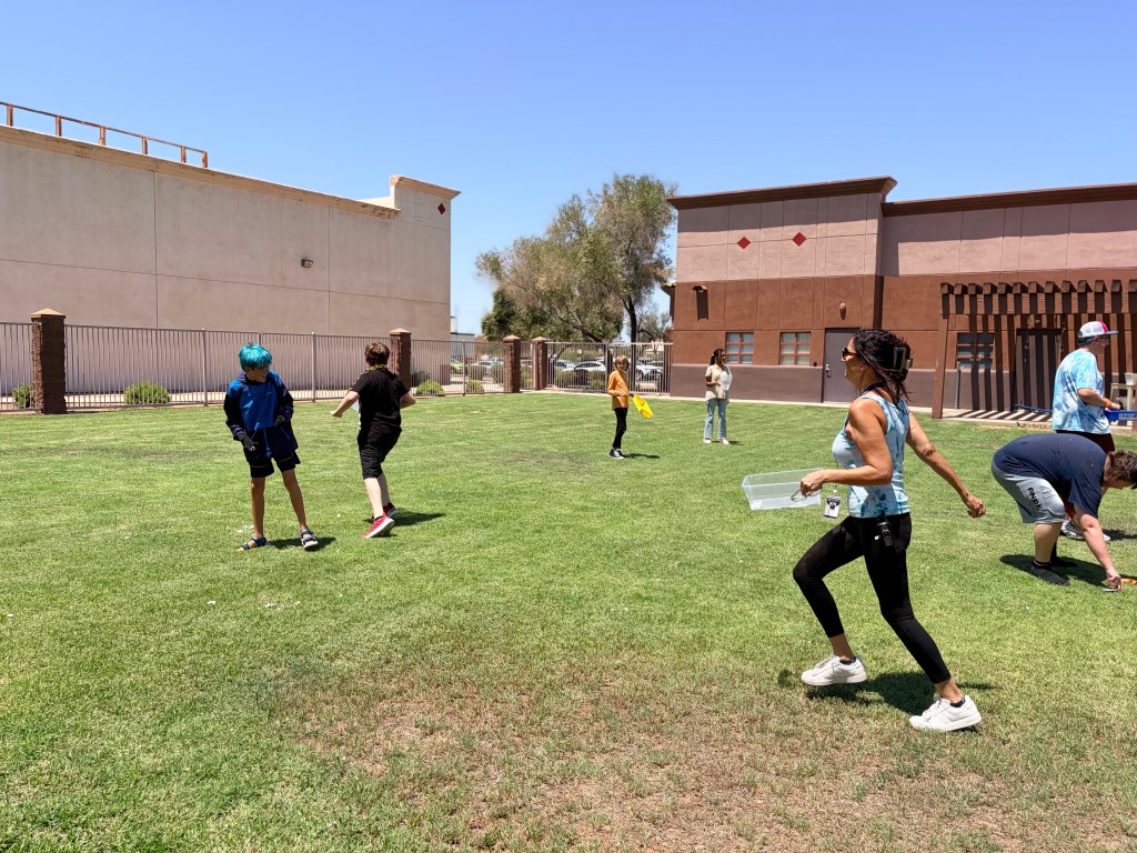 Students and staff gather outdoors for the Snowballs and Snowcones Fun Friday celebration at Sierra School of Gilbert.
