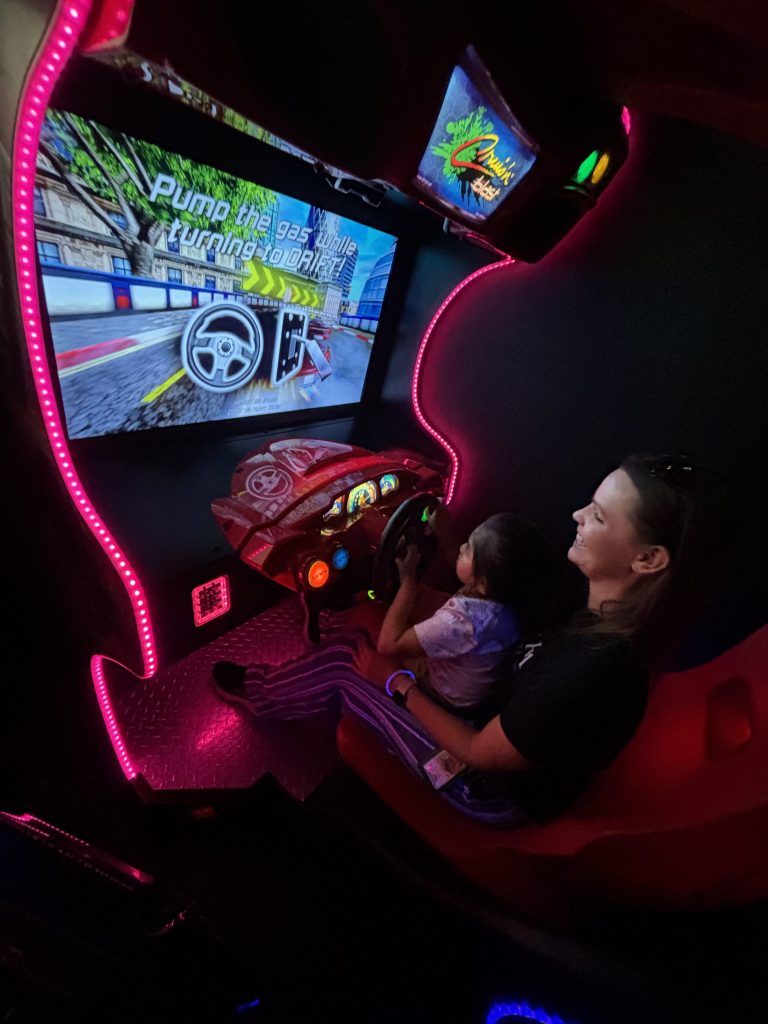Student participating in an arcade activity as part of a Sierra School of Gilbert student incentive