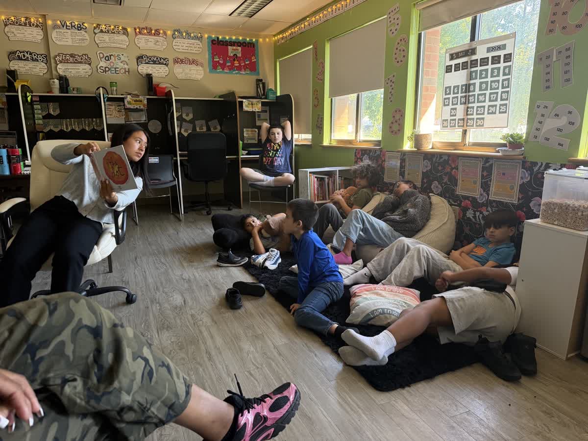 Teacher reads The Dot to students during an International Dot Day classroom activity at High Road School of Fairfield County.